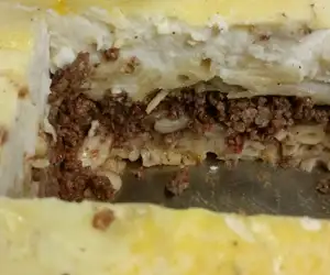Pastitsio- Greek pasta topped with cinnamon-tomato beef and bechamel 